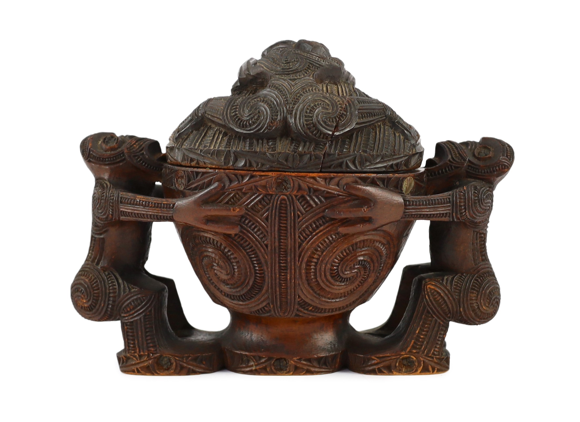 A Maori carved wood oblong bowl and cover, kumete, c.1880-1910, height 23cm length 31cm